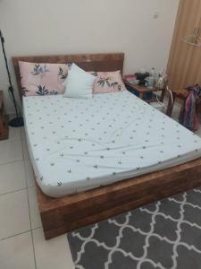 Queen bed with side table -