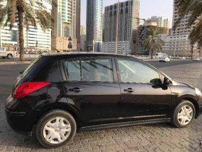 Nissan tIda excellent condition, very less kilometers